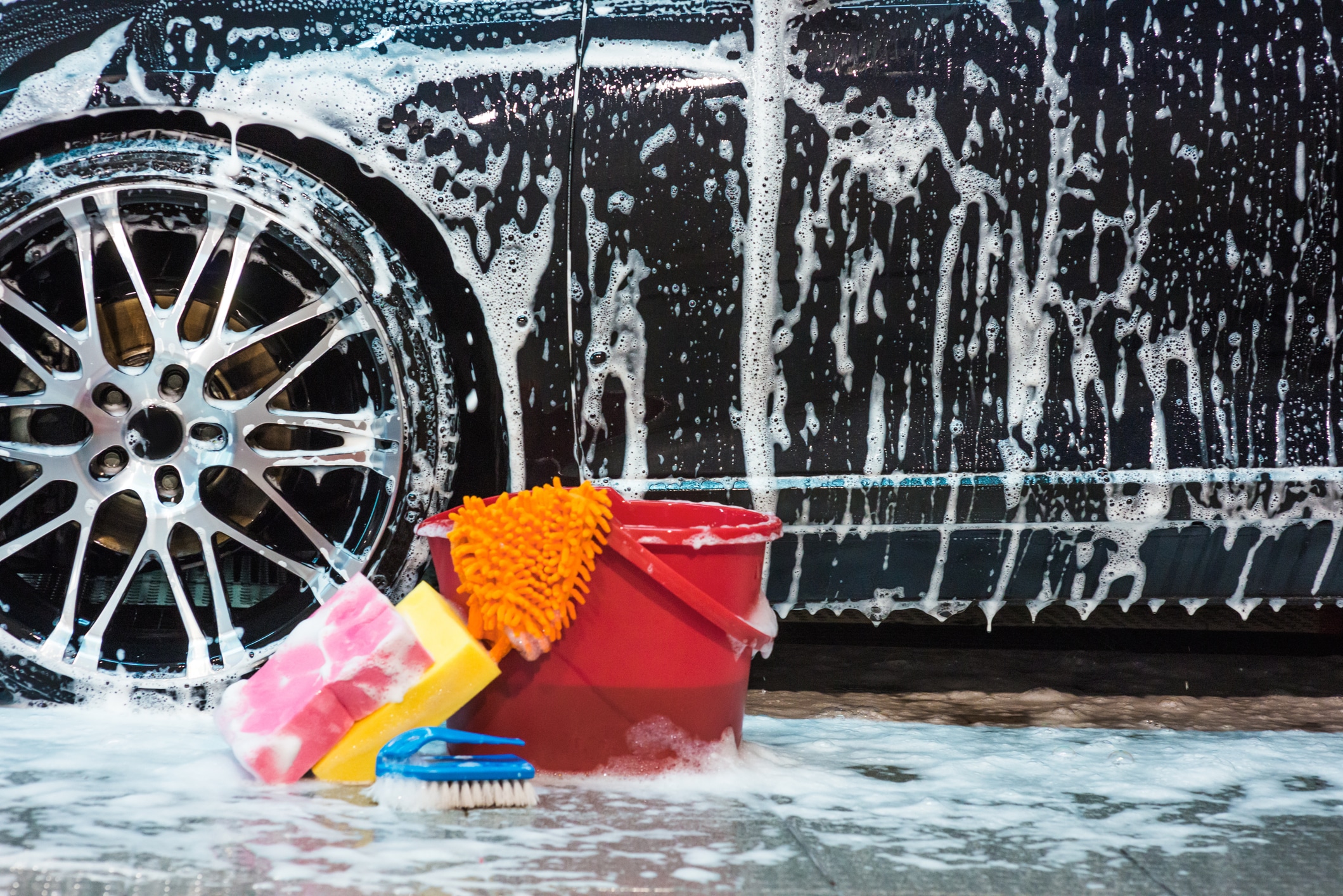 photo of a car going through a car wash